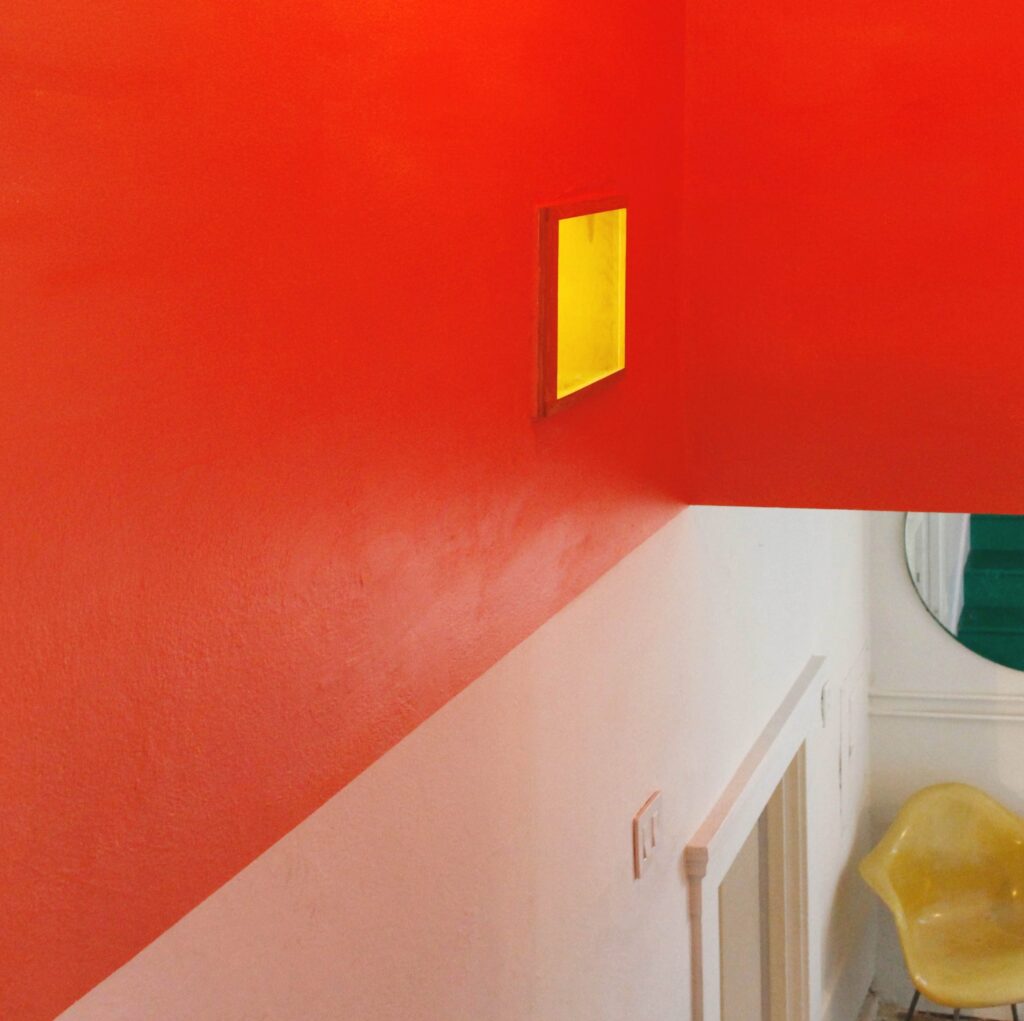 detail of crisp red paint in the stairwell // Casa Nueva by Sky Lanigan Studios